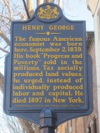Sign post in front of the Henry George Birthplace, Archive, and Historical Research Center